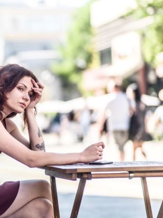 Woman sitting at a table in New York City