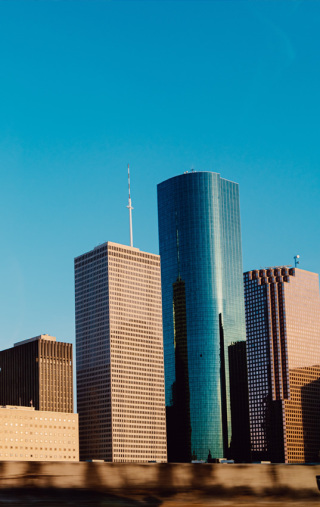 White and blue high rise building in Houston